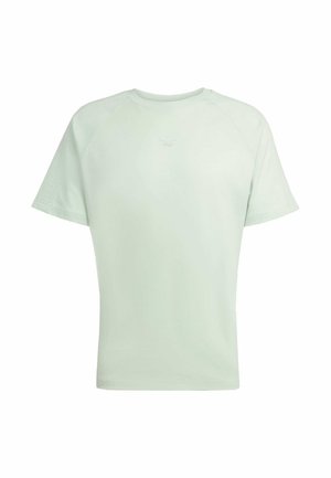T-shirt vert menthe clair en tissu doux, avec des manches raglan courtes et un logo subtil au centre de la poitrine.