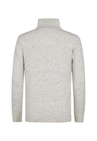 Kerman värissä villapaita, jossa on korkea kaulus ja pitkät hihat. Teksturoitu neule sisältää monivärisiä läiskiä ympäriinsä. Ribbed hihansuut ja helma.