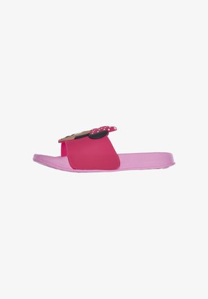 Pink slide sandals featuring a textured strap and a decorative element with polka dots. Made of flexible material, designed for casual wear.