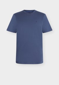 Μπλούζα τύπου t-shirt σε σκούρο μπλε ναυτικό, με κοντά μανίκια και στρογγυλή λαιμόκοψη, κατασκευασμένη από λείο ύφασμα, με διακριτικό λογότυπο στο στήθος και καθαρές ραμμένες άκρες.