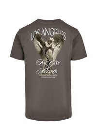 Rjava bombažna majica s grafičnim dizajnom angela z razprtimi krili, napisom "Los Angeles" in citatom spodaj.