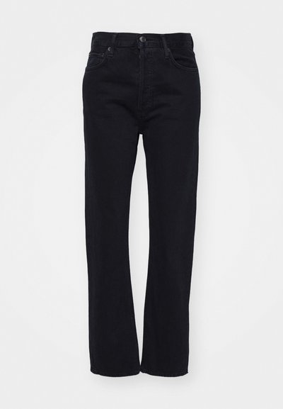 Black denim jeans with a straight leg cut, featuring a classic five-pocket design and a front button closure. Clean, textured fabric.