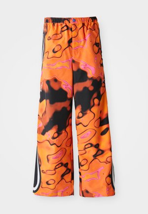 Loose-fitting pants with vibrant orange, black, and pink abstract swirl pattern, elastic waistband, side stripes, and button closure.