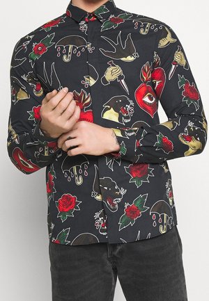 Black fabric shirt featuring a variety of bright tattoo-style prints, including roses, skulls, and umbrellas, with a button-down collar.