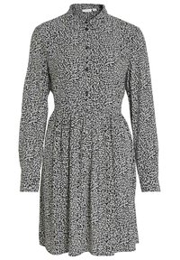 Vestito floreale bianco e nero, con collo, maniche lunghe, chiusura a bottoni frontale, vita arricciata, forma a A, tessuto leggero con un motivo testurizzato.