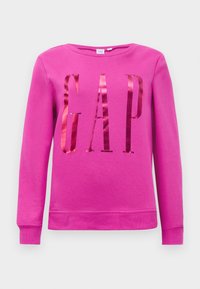Rosa sweatshirt med ordet "GAP" i reflekterende materiale, rund halslinje og lange ermer. Glatt tekstur med ribbede mansjetter.