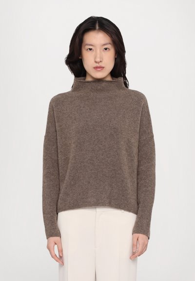 Brown, soft knit sweater with a high neck, dropped shoulders, and a relaxed fit; features a cropped length and subtle texture.