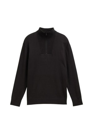 Crni pulover s visokim ovratnikom i polu-zip zatvaranjem. Ima rebrastu teksturu na ovratniku i manžetama, s opuštenim krojem.