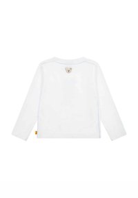 Weißes Langarmhemd mit blauen Nähten. Auffällige Bärenapplikation auf dem Rücken nahe des Halsauschnitts. Aus weichem Baumwollmaterial.