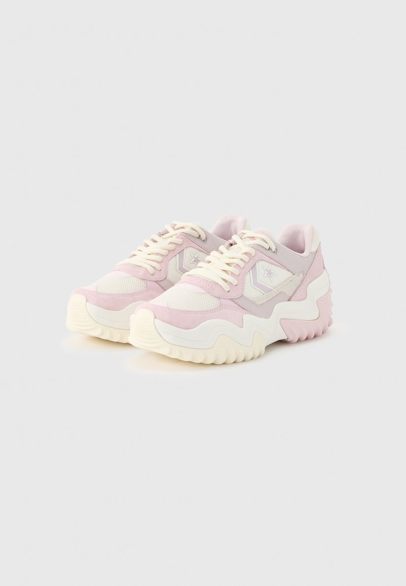 Pair of low-top sneakers with pink and white mesh and suede uppers, thick wavy white soles, and star logo on the side.