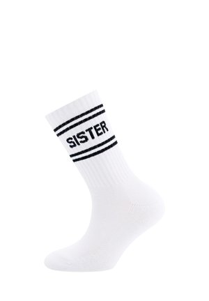 Chaussette en coton blanc avec une texture côtelée, ornée de rayures noires et du mot "SŒUR" en lettres majuscules autour de l'ourlet.