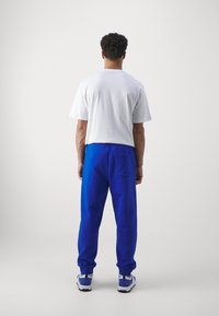 HUGO Träningsbyxor - blue