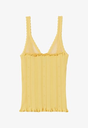 Camiseta sin mangas amarilla de punto acanalado con bordes festoneados y volante en el escote y el dobladillo.