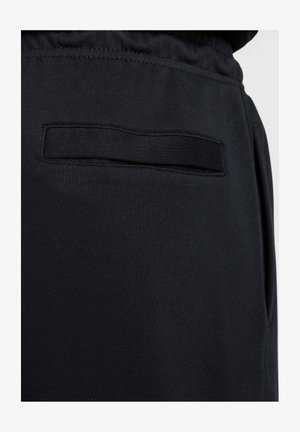 Pantaloni sportivi neri realizzati in un tessuto morbido, con una tasca piatta sul retro, una cintura elastica e una texture liscia. Design minimalista.