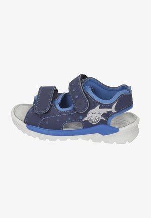 Dunkelblaue Sandalen mit grauen und blauen Akzenten, verstellbaren Velcro-Riemen, offenem Design und Haifischgrafik an der Seite. Gummisohle.