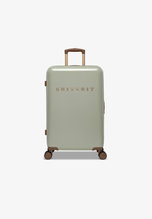 Hard-shell suitcase in muted green, featuring a glossy finish, bronze accents, and a telescoping handle. Four wheels for mobility.