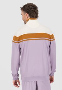 Purple jacket with white and brown horizontal stripes, featuring a high collar and elastic cuffs, made from lightweight, smooth material.