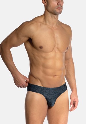 Men's swim briefs in dark blue with a textured pattern. Features a smooth waistband and a snug fit, suitable for water activities.