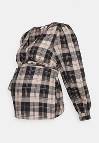 Top envolvente xadrez em preto e bege, com mangas longas e bufantes, decote em V profundo e cintura ajustada, projetado para um ajuste de maternidade.