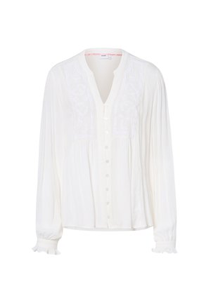 Weiße Bluse mit langen Ärmeln, Knopfleiste vorne, V-Ausschnitt, bestickten Spitzen-Details auf der Brust und Rüschenmanschetten an den Ärmeln.