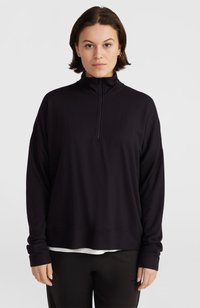Mustaline, pika varrukaga pullover kõrge krae ja poole panne disainiga. Valmistatud pehmest kangast, lõdva istuvuse ja soonikkätistega.