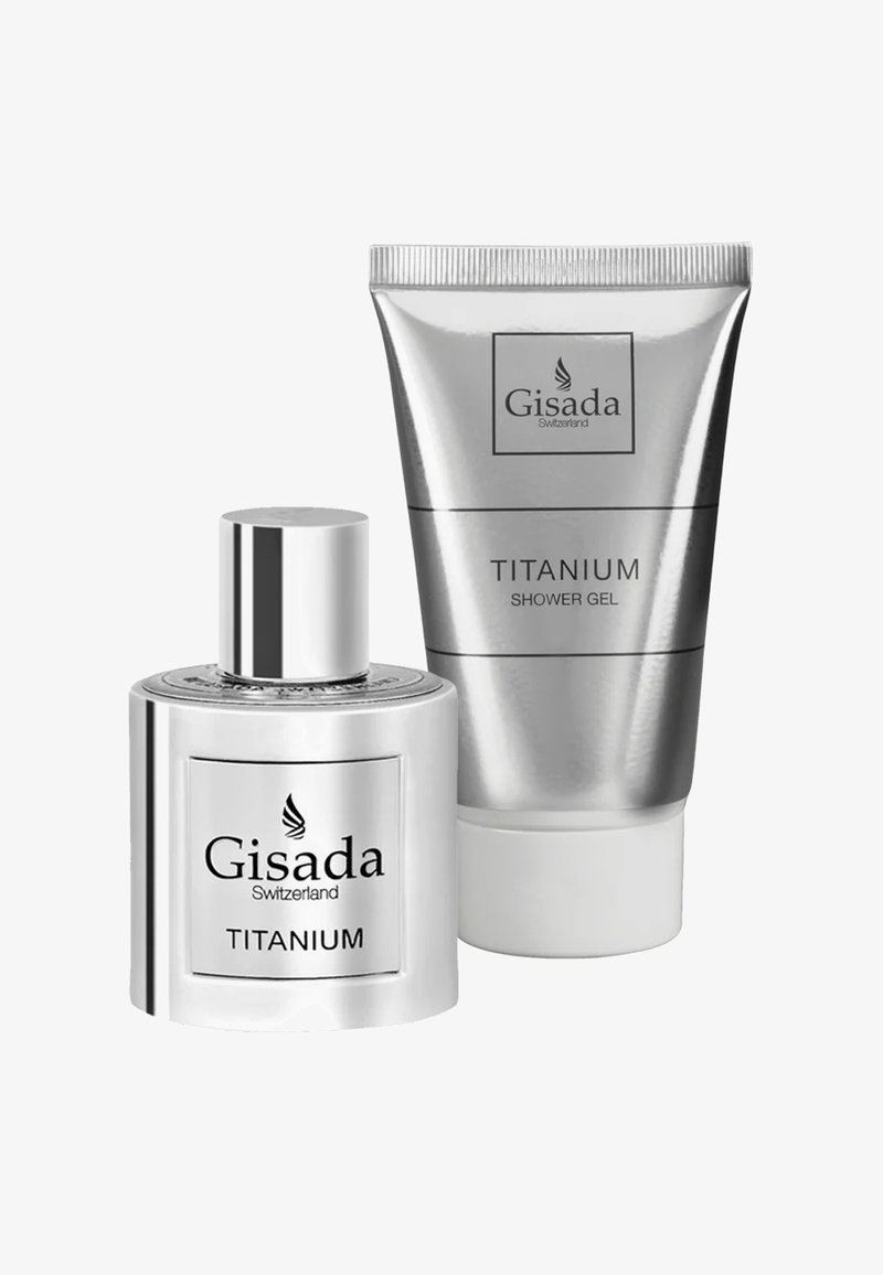 Tube de gel douche couleur argent et flacon de parfum arrondi avec une finition métallique, tous deux étiquetés "Gisada Titanium."