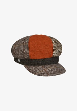 Flat cap with a short brim, featuring patchwork panels in brown herringbone, rust orange, and mixed tweed fabrics.