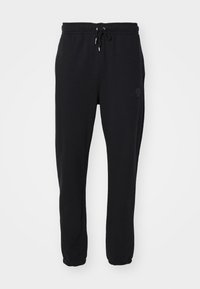 FLIGHT - Tracksuit bottoms - black