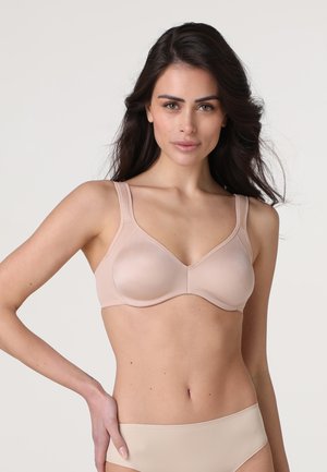 Reggiseno beige con spalline regolabili, texture morbida e design a V classico. Il tessuto è morbido e senza cuciture, garantendo comfort.