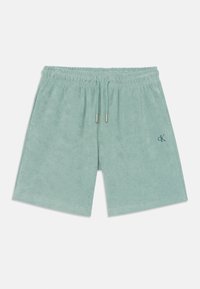 Shorts in morbido terry cloth verde chiaro, con vita elasticizzata e cordino. Presentano tasche laterali e un piccolo logo ricamato.