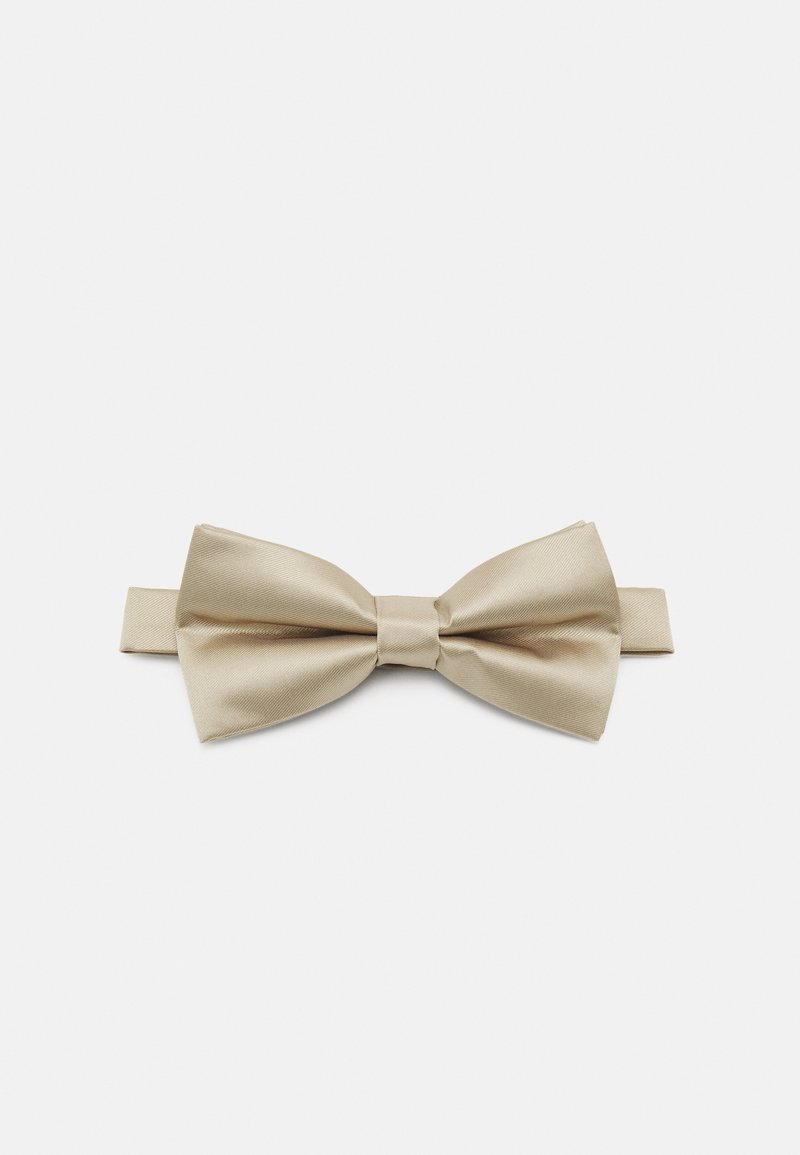 Satin bow tie in light beige, featuring a classic butterfly shape with a central knot. Smooth texture with a subtle sheen.