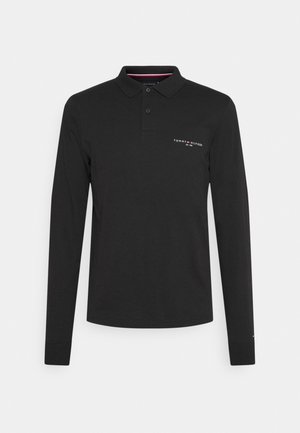 Černá polokošile s dlouhým rukávem a límečkem, dvoubotónovou légou a malým bílým logem "Tommy Hilfiger" na levé části hrudníku.