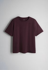 Short-sleeve crew neck T-shirt in deep burgundy, hanging against a plain light gray background.