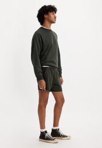 Levi's® PRIDE GRAPHIC UNISEX - Trainingsbroek - pirate black