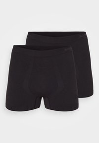 Schwarze Baumwoll-Boxershorts mit nahtlosem Design, featuring eine unterstützende Fronttasche und einen weichen Bund, präsentiert im Paar.