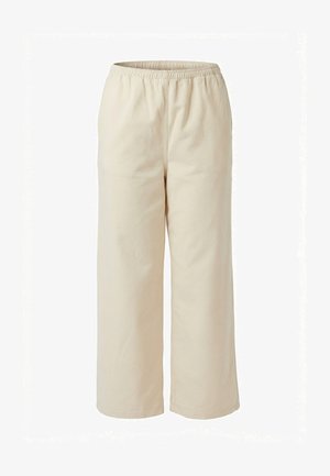 Pantalon beige coupe ample avec taille élastique, jambes droites, sans poches visibles ni ornements, présenté sur fond blanc.