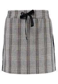 Jupe en tissu tissé avec un motif chevrons noir et blanc. Elle dispose d'une taille élastique avec un cordon noir et des accents sur les côtés.