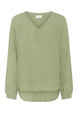 Ljusgrön långärmad blus med V-ringning och utan knappar; något längre bakparti; textil med mjukt avslut.