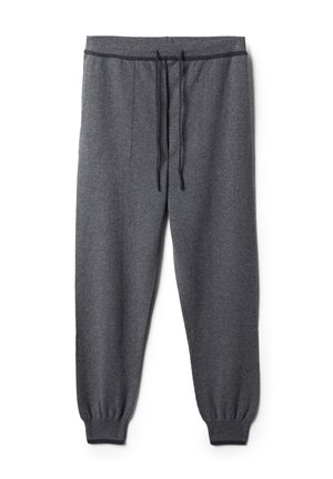 Grå sweatpants i mjukt material, med elastisk midja och dragsko, smalnande ben och elastiska manschetter vid anklarna.