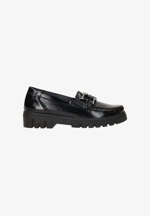 Black leather loafers with a shiny finish, featuring a decorative buckle. Chunky black rubber sole with a treaded pattern.