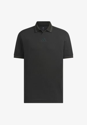 Polo noir à manches courtes avec col et logo Adidas subtil centré sous l'encolure.