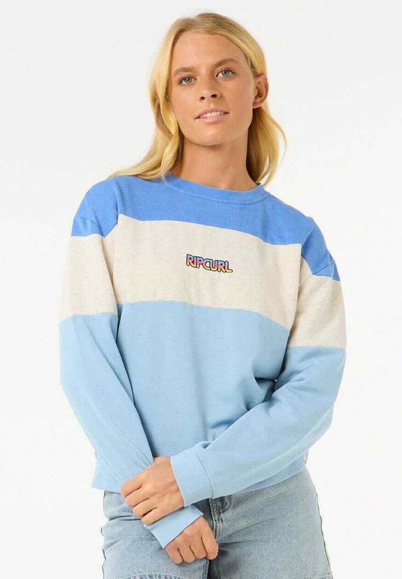 Sudadera azul claro y crema con mangas largas, puños acanalados y cuello redondo. Presenta el logo "RIPCURL" en texto colorido en el pecho.