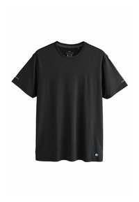 T-shirt de sport noir à manches courtes et col rond avec logos discrets sur les manches et l'ourlet inférieur, taille moyenne.
