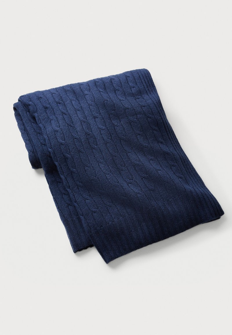 Navy knitted scarf featuring a cable pattern with a ribbed border, made from a soft fabric, folded neatly to display texture and color.