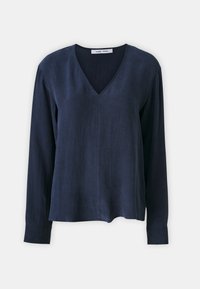 Navy long-sleeve blouse with a V-neck, made of a soft, textured fabric. Features a loose fit and subtle stitching details.