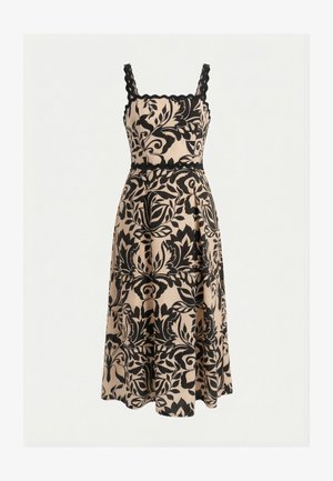 Mouwloze beige midi-jurk met zwart bloemenpatroon en geschulpte randen aan de bandjes en halslijn.