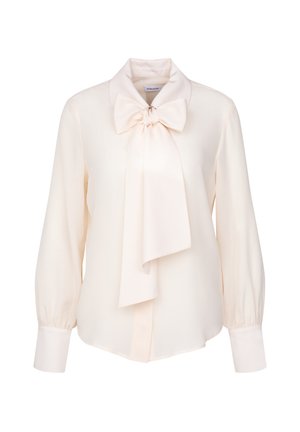 Cream-colored blouse with a large bowtie collar, long puff sleeves, and buttoned cuffs. Made of smooth, lightweight fabric.