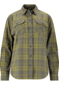 Grön rutig flanellskjorta med knäppning, långa ärmar, bröstfickor och rundad nederkant. Tillverkad av mjukt, texturerat tyg.