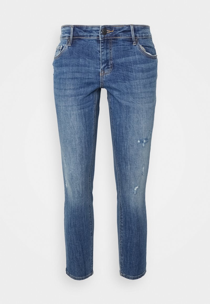 Jeans ajustados azules con ligero desgaste y detalles desgastados en los muslos frontales, bolsillos delanteros, pasadores de cinturón y cierre de botón.