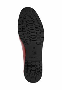 Red leather shoe with a textured finish and a contoured black rubber sole featuring a patterned tread for grip. Size 37 indicated.